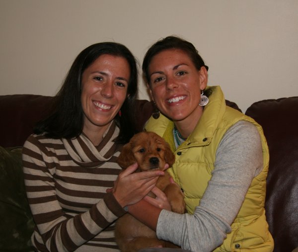 puppy with new owner and friend